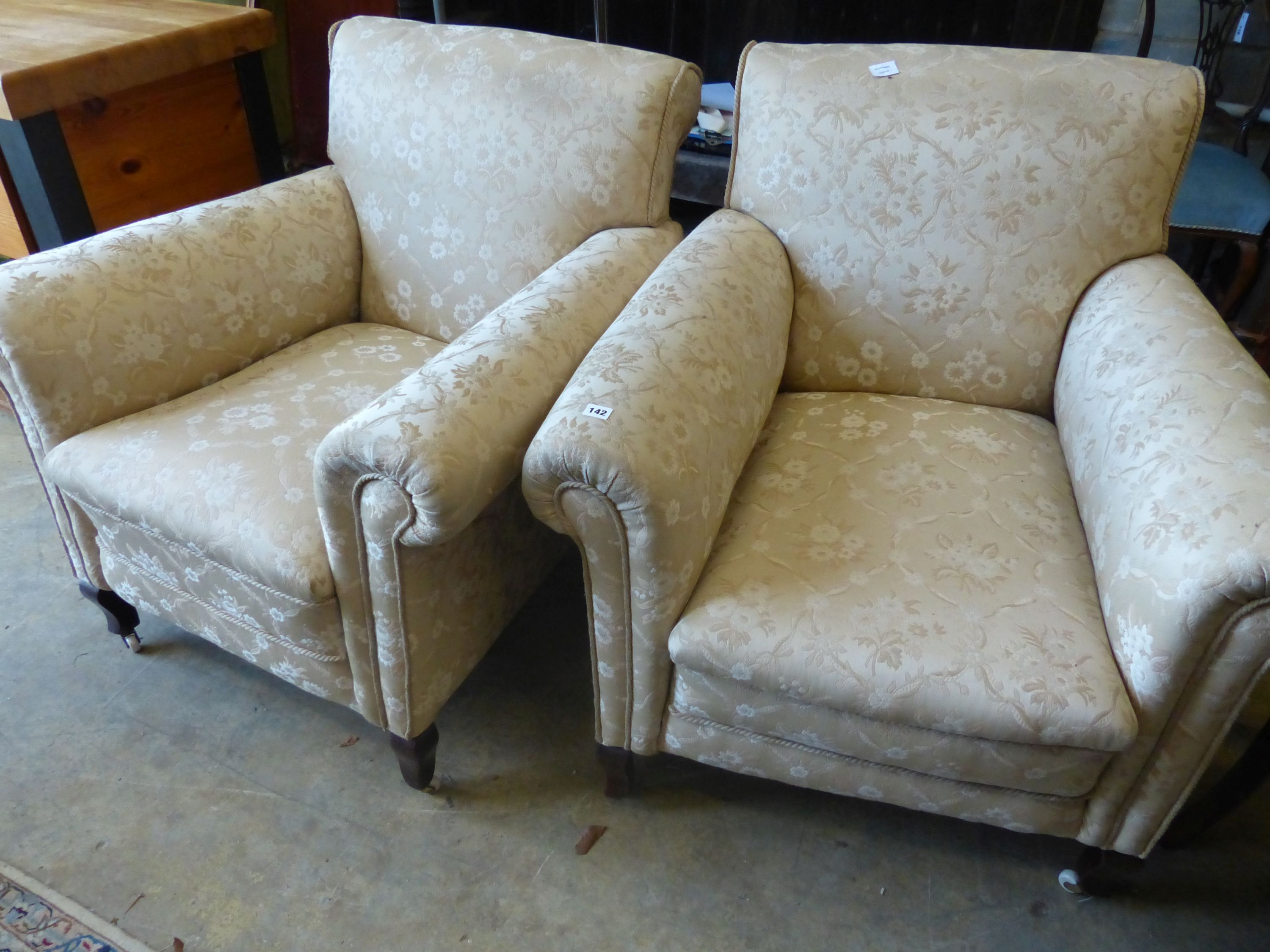 A pair of early 20th century upholstered armchairs, width 90cm, depth 94cm, height 94cm